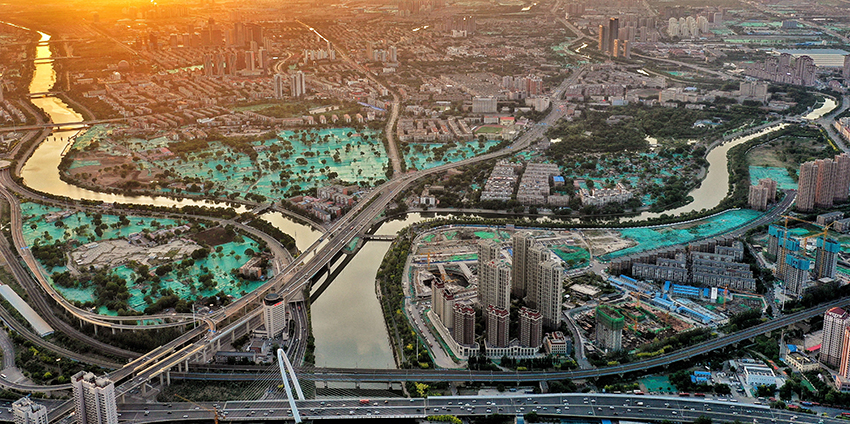 晚霞中的天津三岔河口，南北運河與海河交匯處。   王偉攝