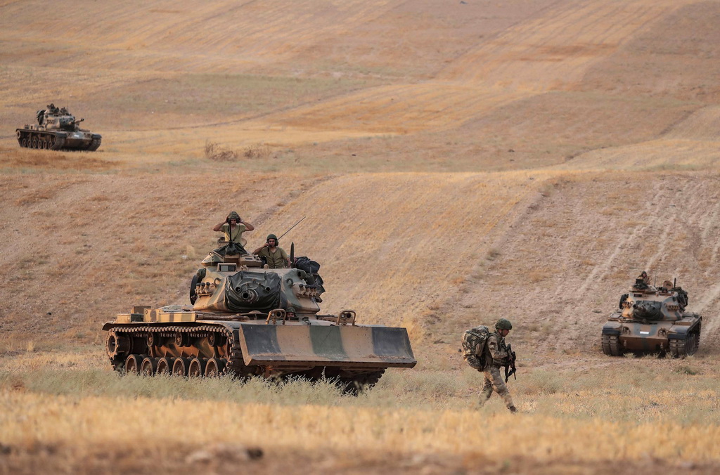 10月14日，土耳其軍隊向敘利亞北部重鎮曼比季行進。新華社/美聯