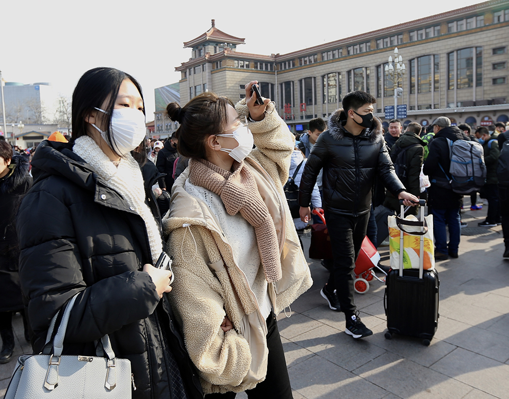 3.1月21日，北京站，旅客戴口罩出行。鄒紅攝影