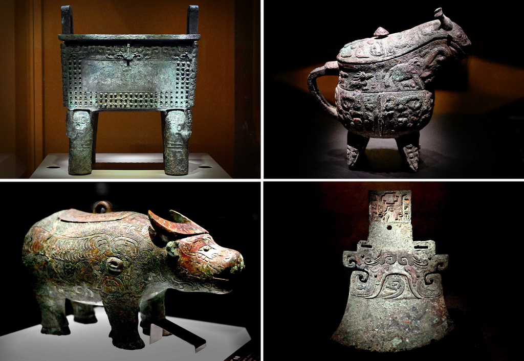 這是河南安陽殷墟博物館新館內展出的“司母辛”銅鼎（左上）、“亞長”銅觥（右上）、“亞長”牛尊（左下）、“亞長”銅鉞（拼版照片，2月23日攝）。
