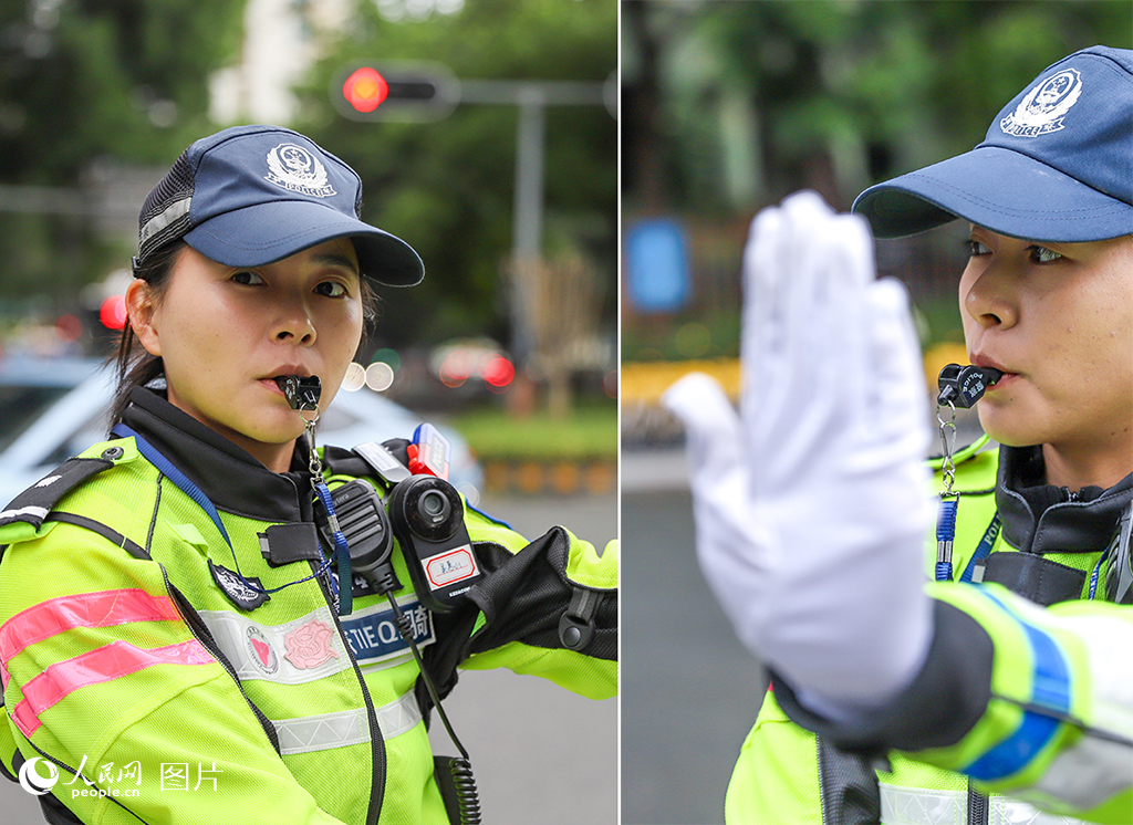 深圳市公安局交警支隊機訓大隊二中隊民警吳惠山正在路口指揮交通。人民網 王星攝